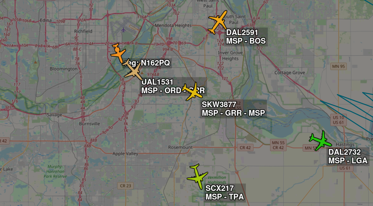 screenshot of a map with aircraft, their route, and callsigns displayed in their actual location